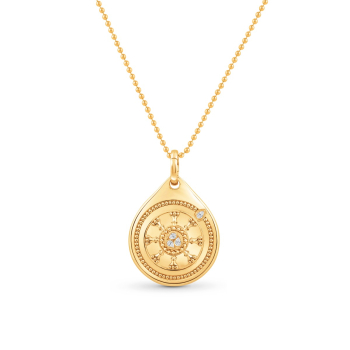 Yellow gold pendant necklace that has ‘Wheel’ engraved in the charm, it is surrounded by Indian pota work studded with 1 pear shape colorless natural diamond facing the north east direction. This charm bracelet is a part of our Drops of JOY collection